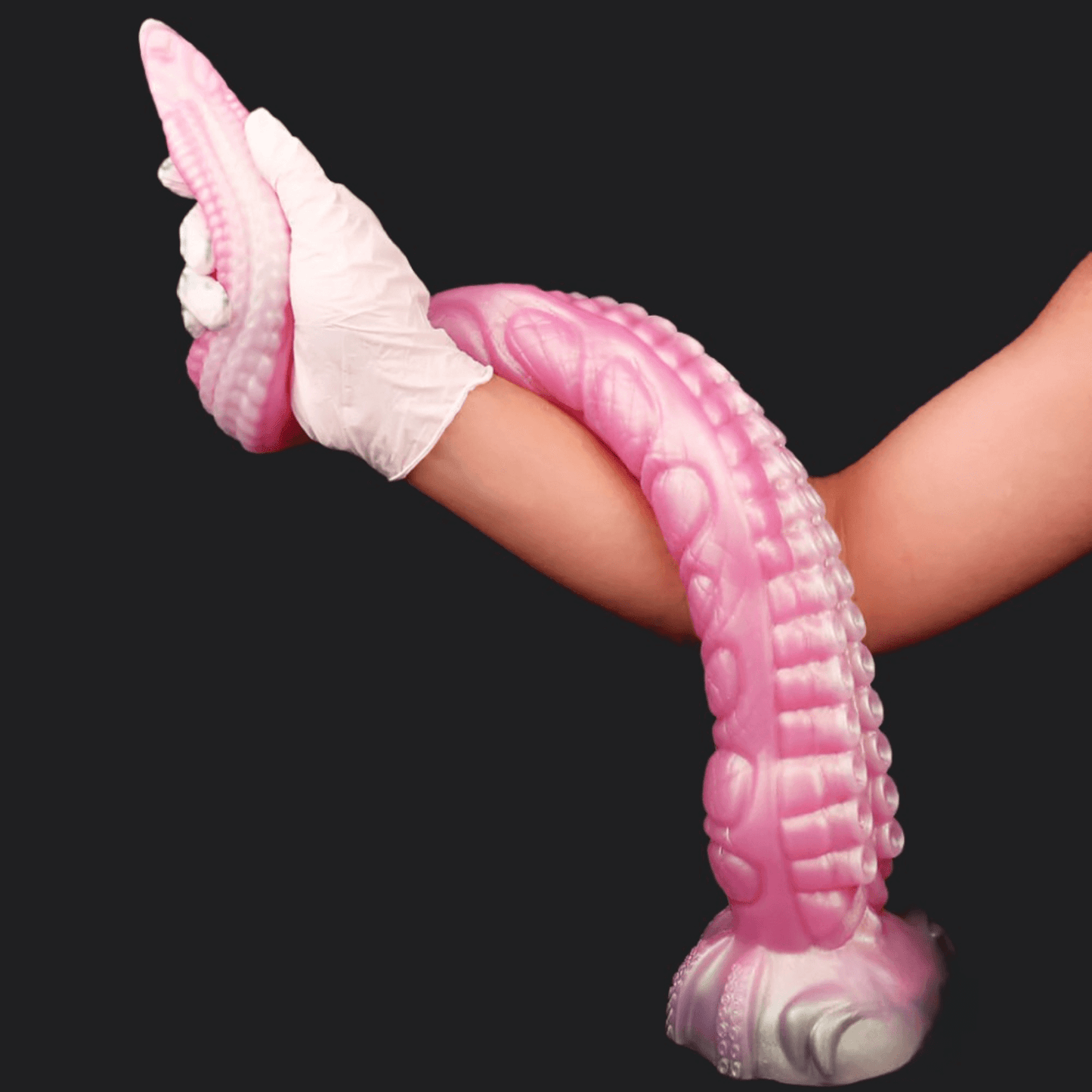 Close-up of a pink Octopus Elder Tentacle Dildo, showcasing its textured surface and flexible design for ultimate pleasure.